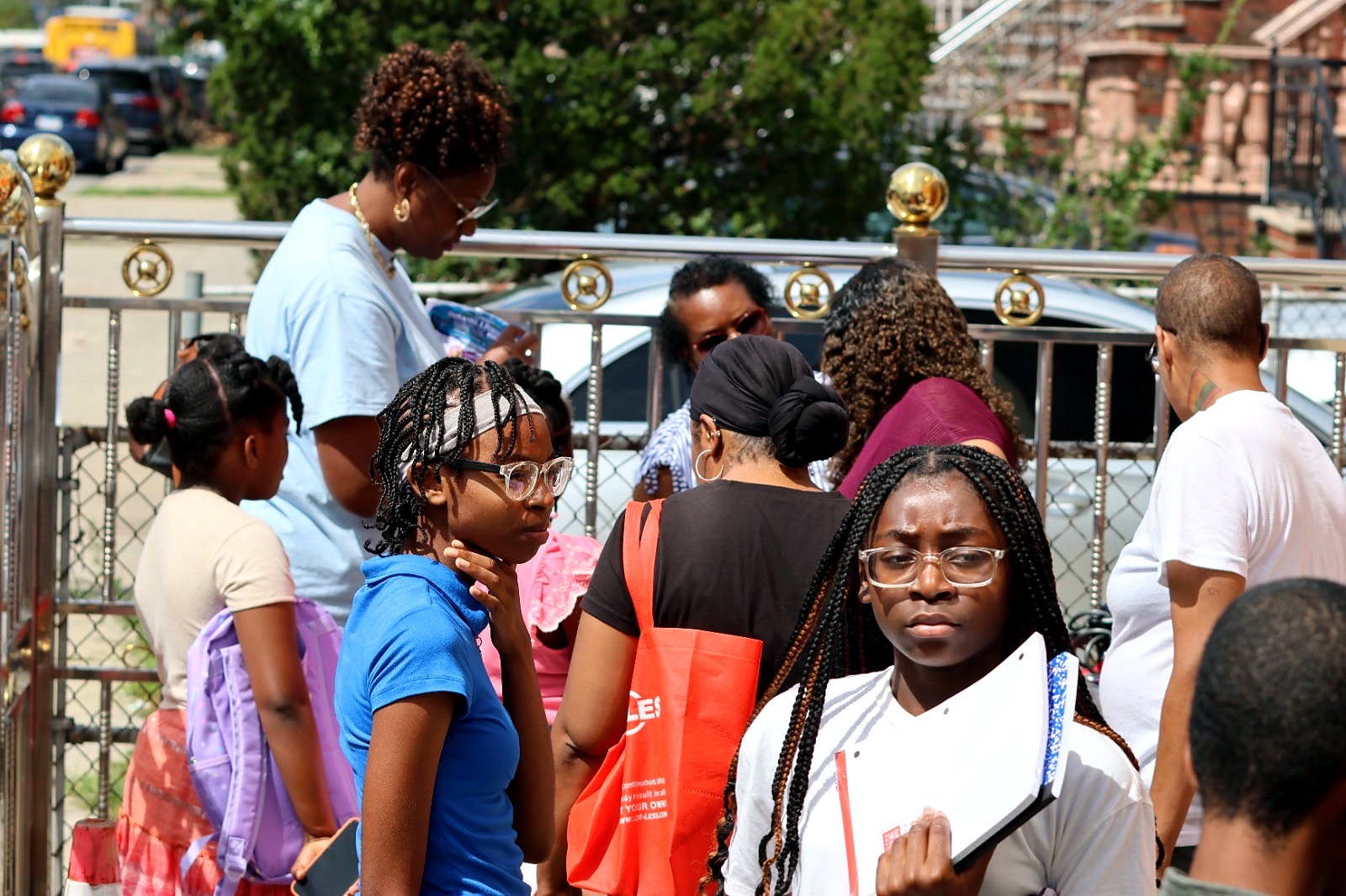 Families and children gather during back-to-school outreach.
